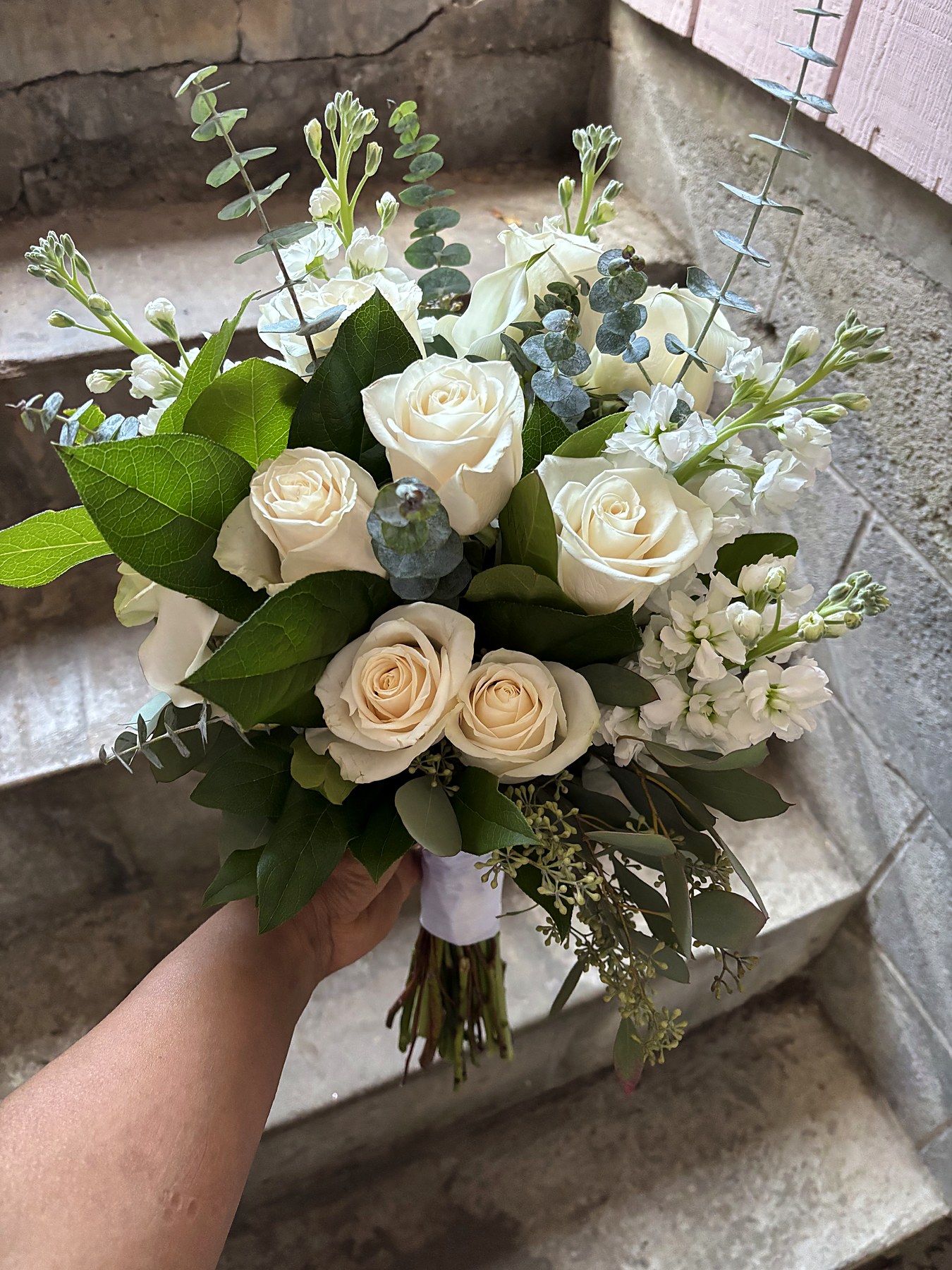 Elegant white and cream bridal bouquet with eucalyptus