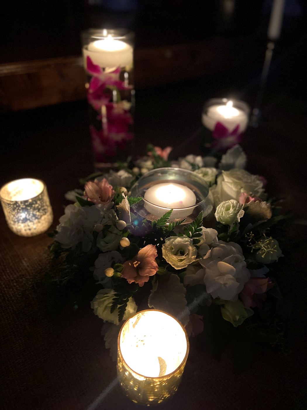 Styled floral centerpiece with candlelight