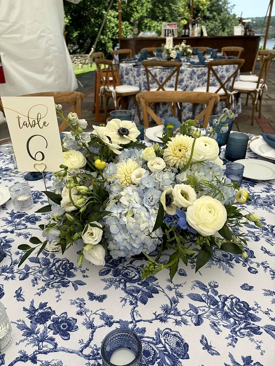 Table 6 centerpiece with blue hydrangea, anemones, and dahlias