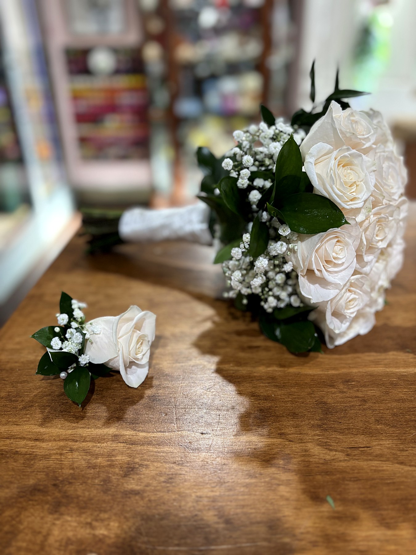 White rose bouquet with matching boutonniere
